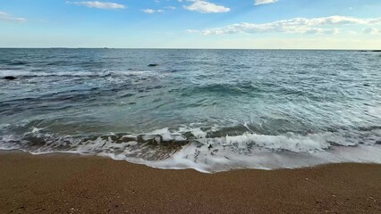 Calming Sea Waves Gently Rolling on a Sandy Beach A Perfect Tranquil Escape for All