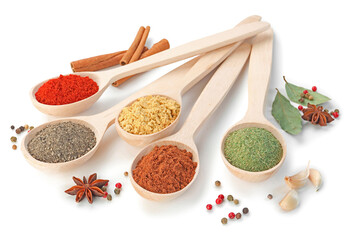 Different aromatic spices in spoons isolated on white