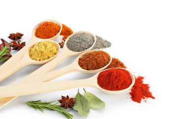 Different aromatic spices in spoons isolated on white