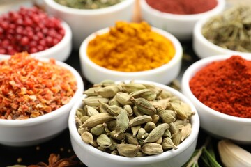 Many different aromatic spices on table, closeup