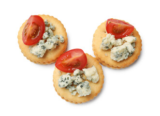 Tasty crackers with blue cheese and tomatoes isolated on white, top view