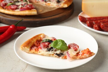 Slice of tasty pizza with thin smoked sausages served on light table, closeup