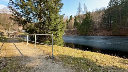 Enjoy the serene and picturesque lakeside views that come alive in early springtime