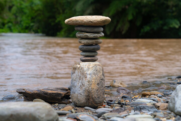 Balancing stones in nature, rivers and jungle