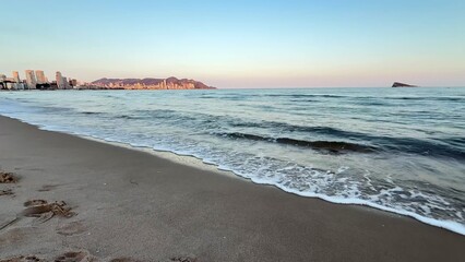 Experience the Serene Coastal Sunset at the Beach, a breathtaking view that captivates