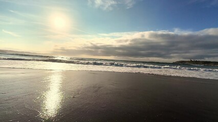 A Beautiful and Serene Sunset Over a Tranquil and Peaceful Beach Shore Awaits You