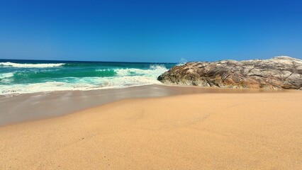 Stunning Scenic Beach View Featuring Waves and Beautiful Rock Formation Along the Coastline