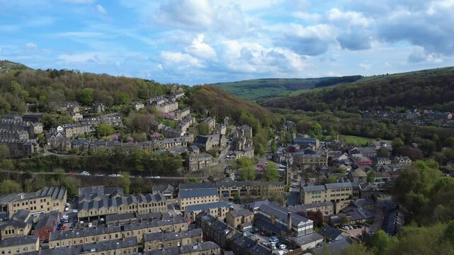 panoramic aerial drone shot or the town of hebden bridge in west yorkshire with surrounding calderdale countryside