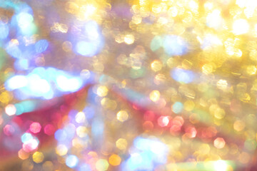 Fototapeta premium Colorful abstract bokeh with yellow, blue, and red shimmering lights