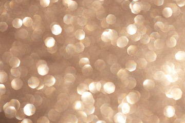 Golden bokeh background with soft glowing light and dreamy atmosphere