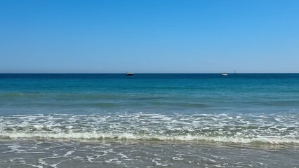 Enjoy the Serene and Beautiful Beach Waves on a Warm, Sunny Day by the Ocean Shoreline