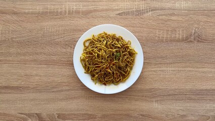 A Stunning and Delicious Plate of StirFried Noodles Served Beautifully on a White Plate