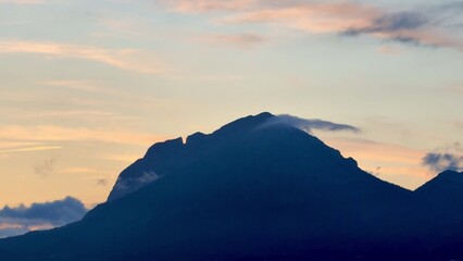The Majestic Mountain Silhouette is beautifully illuminated at Dusk, creating a stunning view