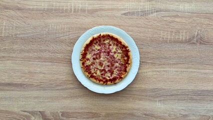 Indulgent and Delicious Pizza Slice Placed on Rustic Wooden Table Ready to Be Enjoyed