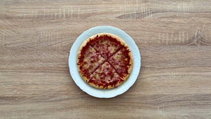A Delicious, Mouthwatering Pizza Served on a Clean White Plate Captivating Top View