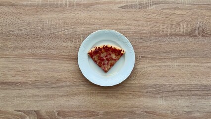 A Delicious Slice of Pizza Served on a Plate That Looks Absolutely Mouthwatering