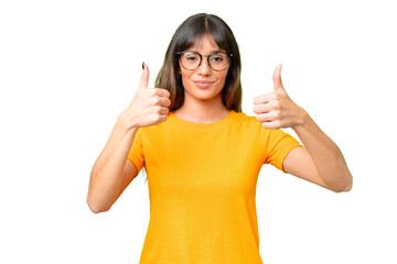 Young caucasian woman over isolated chroma key background giving a thumbs up gesture
