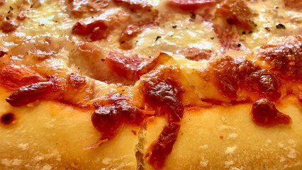 Closeup of a delicious pepperoni pizza with a crispy golden crust, incredibly appetizing
