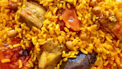 Enjoy the tasty Jollof Rice with savory meat and fresh vegetables, ideal for gatherings