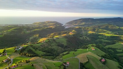 Experience the Stunning Aerial Views Showcasing Lush Green Rolling Hills and Majestic Mountains