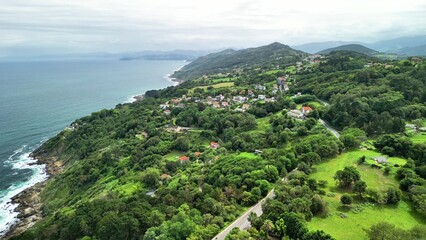 A breathtaking Aerial View showcasing a stunning Lush Coastal Landscape with Scenic Waters