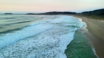 A Stunning Aerial View of Serene Ocean Waves at Dusk That Captivates the Senses and Inspires