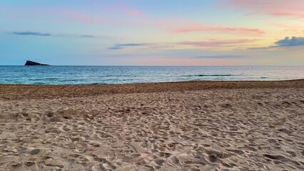 A Serene Beach Sunset Slowly Unfolding Over Calm Waters, Creating a Beautiful Scene to Admire