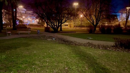 A Serene Night Park Scene Featuring Beautifully Illuminated Trees and Relaxing Atmosphere