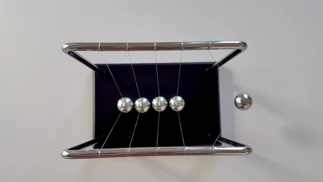 Newtons Cradle Effectively Demonstrating the Principle of Conservation of Momentum