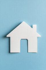 Fototapeta premium Minimalist home silhouette against a calming blue backdrop. A symbol of shelter, stability, and the dream of owning a house.
