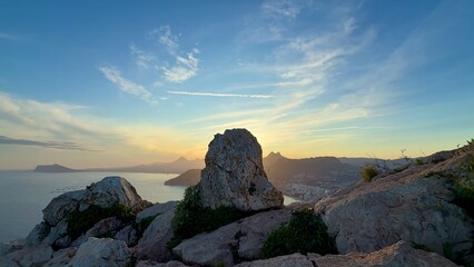 A Beautiful Scenic Coastal View with Rugged Rocks at Sunset, Perfect for Relaxation and Exploration