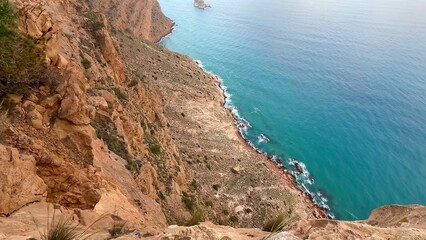 Fototapeta premium Breathtaking and Stunning Coastal Cliffs Positioned Overlooking the Serene, Calm Ocean Waves