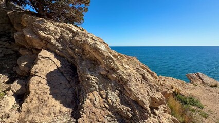 Experience breathtaking coastal views with unique rock formations and lush greenery