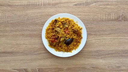 Enjoy the rich flavors of Nigerian Jollof Rice with vibrant vegetables and your choice of protein