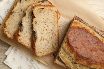 Cut banana bread on table, top view