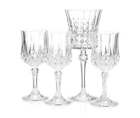 Different empty clean glasses isolated on white