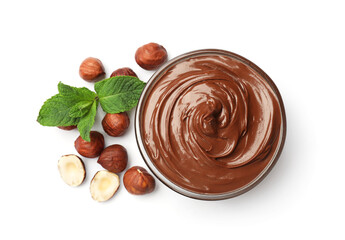 Chocolate hazelnut spread in bowl, nuts and mint isolated on white, top view