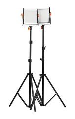 Professional lighting equipment with tripods isolated on white