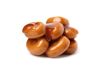 Tasty sweet candies and caramel sauce isolated on white