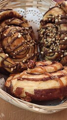 Delightful pastries swirl with chocolate and nuts in a charming bakery setting during morning hours