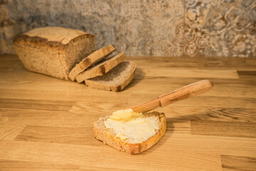 butter, bread, spreading butter, butter knife, homemade bread, natural, baking, kitchen counter, wooden table, baked, fresh, sandwich