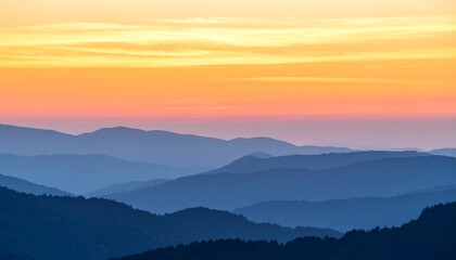Obraz premium Sunset Hues Over Layered Mountains
