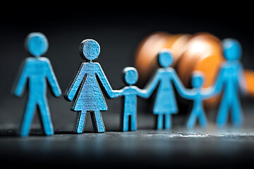 Family Matters: Legal Decision - Wooden figures represent family dynamics and a court gavel suggests legal proceedings, decision-making, and potential disputes.