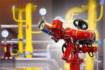 Fire hydrant near gas equipment. Fire extinguishing equipment. Stationary fire monitor. Blurred gas...