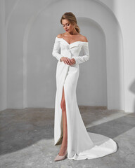Elegant woman in off-shoulder white dress