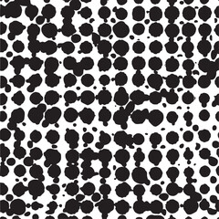 Fototapeta premium A dynamic abstract of black and white circular dots covers the entire composition.