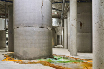 Leakage of Colored Water from Damaged Concrete Support Pillars Possibly Indicating an Issue with a...
