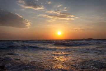 Sunset landscape above the sea surface