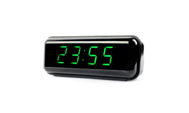 Digital alarm clock showing 23:55 o'clock on white background