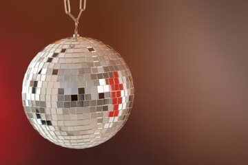 Shiny disco ball on color gradient background. Space for text
